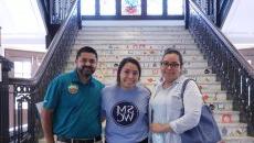 Family stands a student at move-in day